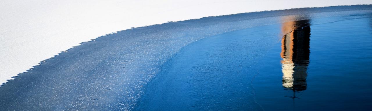 Student walking through GVSU.